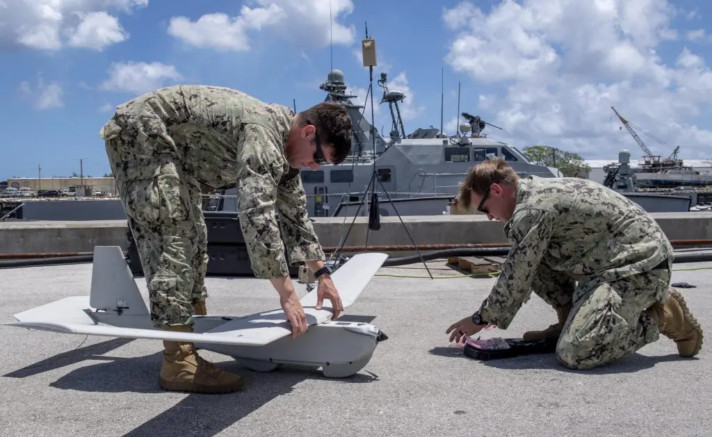 CRS_2_sailors_assemble_an_RQ-20B_Puma_during_visit_to_U.S._Naval_Base_Guam_by_Palau_Vice_President_and_his_delegation-1024x629