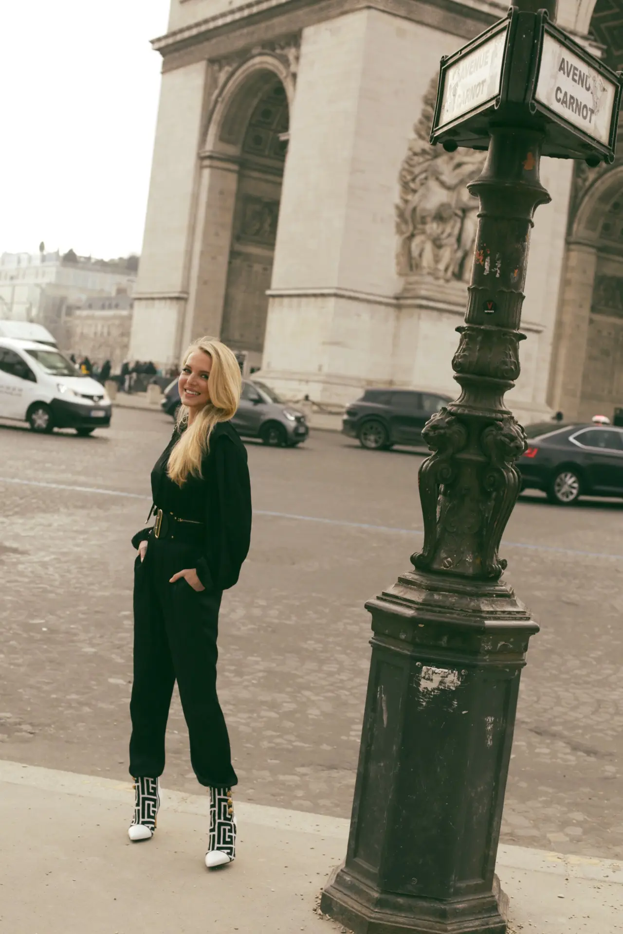 Wide-black-belt-by-Dior-over-a-silky-Maje-jumpsuit-in-Paris-France-with-Balmain-black-and-white-boots-2