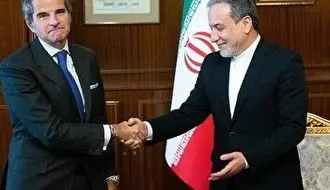 لحظه امضای توافق نامه همکاری آژانس بین المللی انرژی اتمی و ایران + فیلم