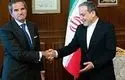 لحظه امضای توافق نامه همکاری آژانس بین المللی انرژی اتمی و ایران + فیلم