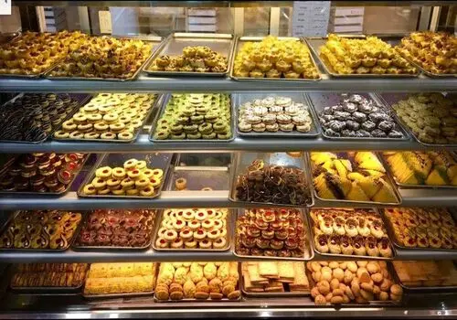 طرز تهیه شیرینی کنجدی ویژه پذیرایی عید نوروز+فیلم