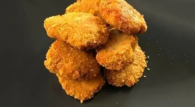 ۶۰ ناگت خوشمزه با تنها ۱ کیلو مرغ؛ دستور پختی ساده و مقرون‌به‌صرفه+ فیلم
