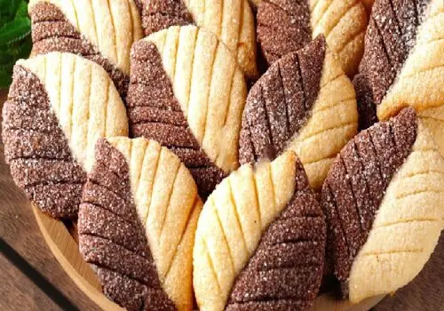 طرز تهیه خوشمزه ترین شیرینی های پا درازی عسلی فقط در ۷ دقیقه+ فیلم / متفاوت ترین روش پخت شیرینی پا درازی عسلی