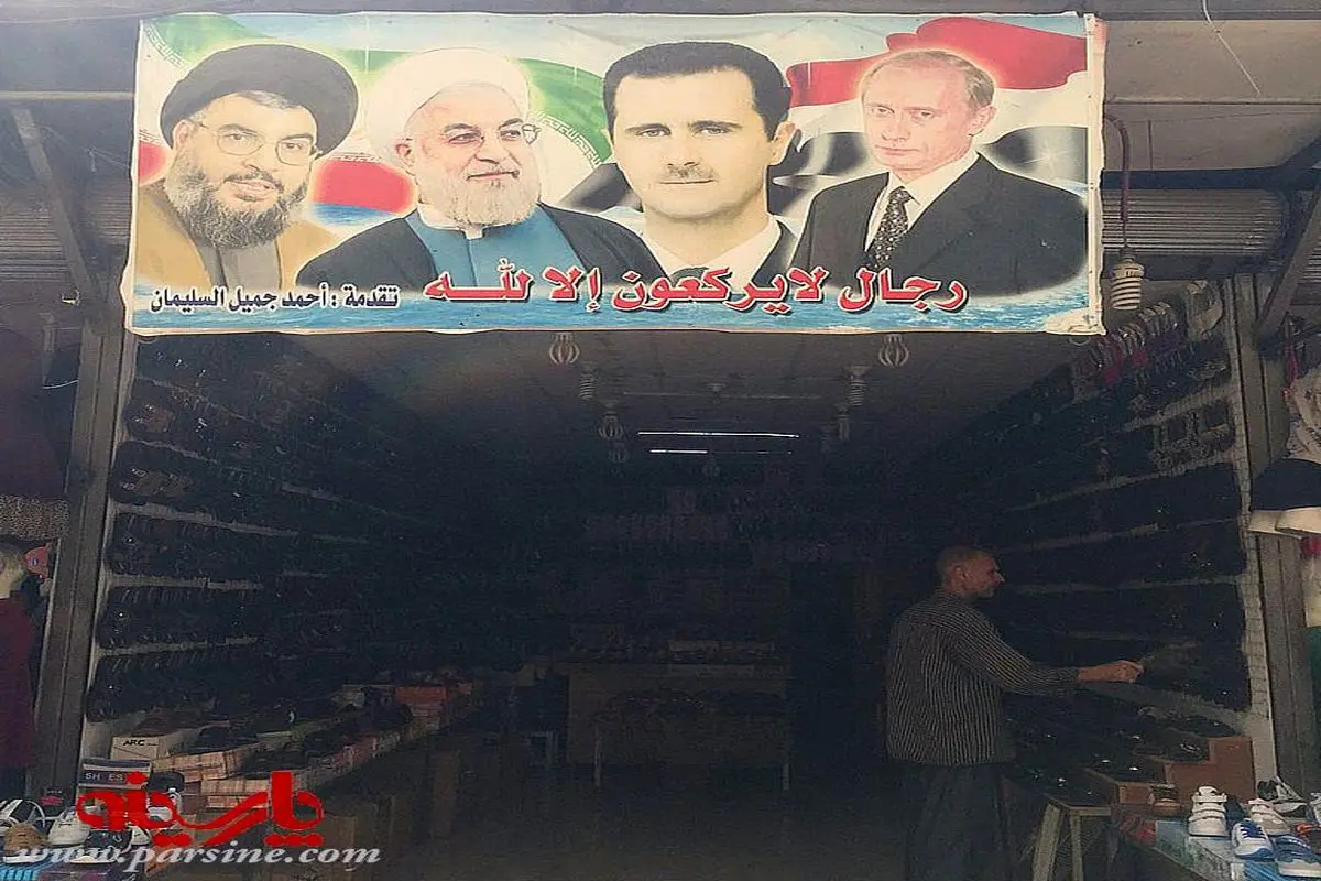 عکس:پوستر پوتین،روحانی و بشار اسد در دمشق