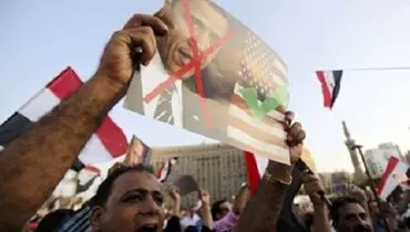 حمله شدید مخالفان مرسی به اوباما + عکس