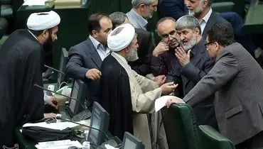 عکس/ مجادله مطهری و حسینیان در مجلس