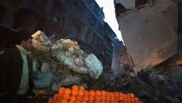 عکس/ پرتقال فروشی در کنار ویرانی های سوریه