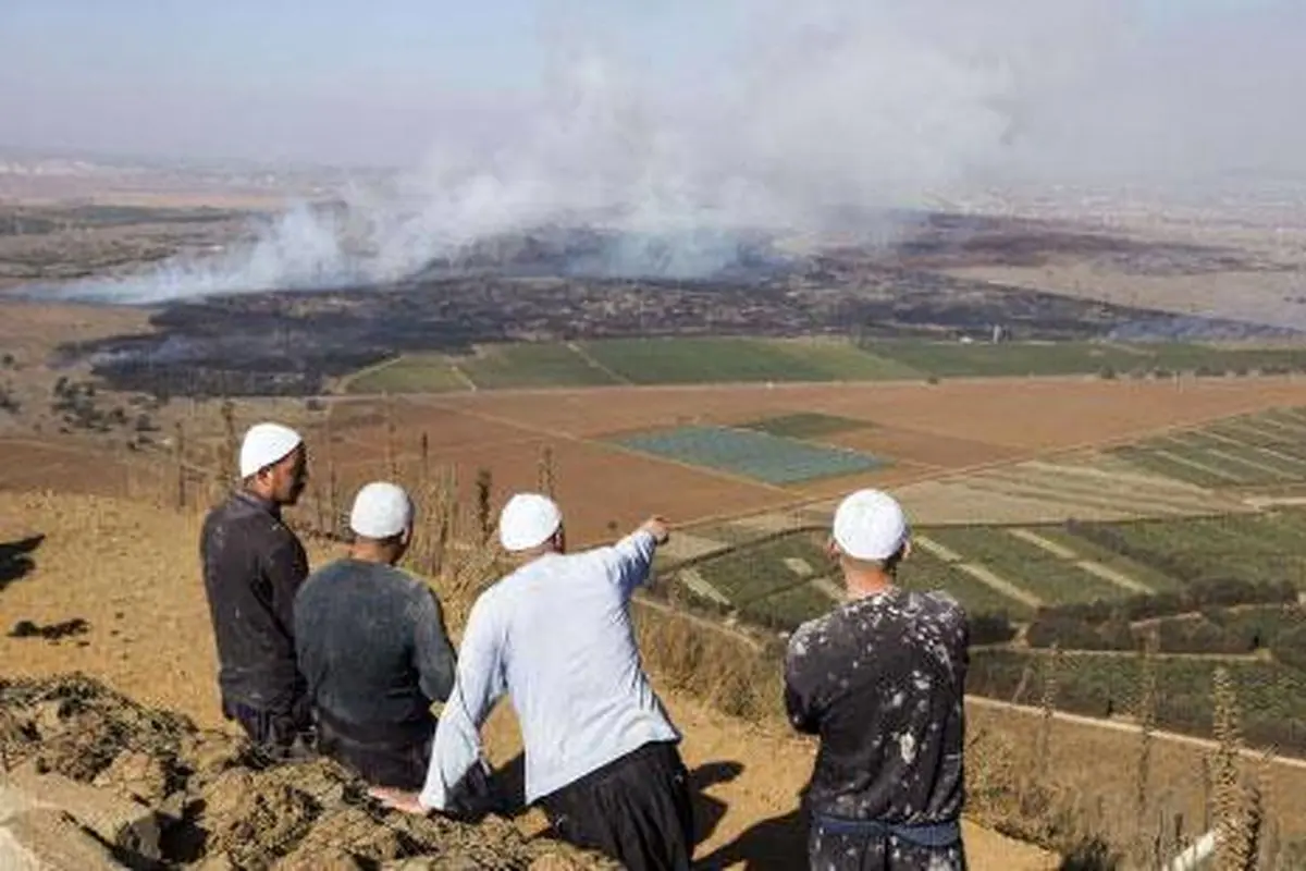 عکس: اسرائیلی ها درگیری ارتش سوریه و مخالفان مسلح را تماشا می کنند