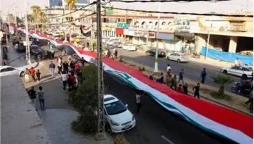 پرچم ۵۰۰متری عراق بردوش مردم کرکوک