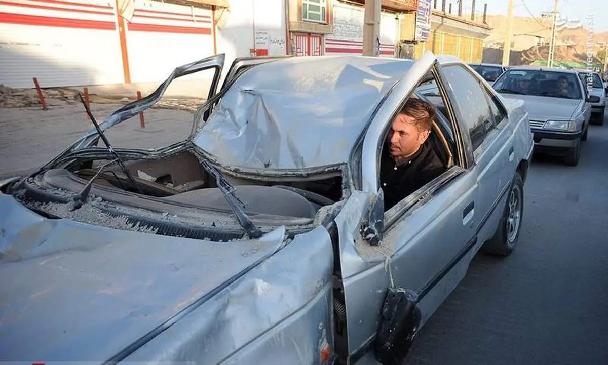 تلاش برای راه اندازی یک خودرو در سر پل ذهاب +عکس