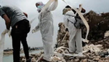 جمع آوری جنازه ها از شهر موصل