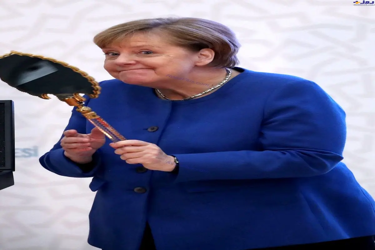 ژست بامزه صدراعظم آلمان پس از دریافت هدیه اردوغان+عکس