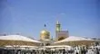 تعویض پرچم گنبد مطهر امام هشتم (ع)/عکس