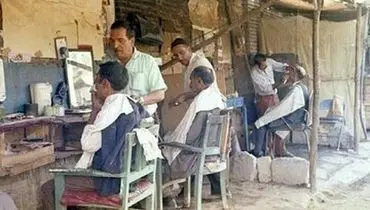 تصویری قدیمی از بساط سلمانی های میدان شوش+ عکس