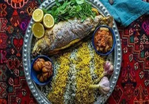 طرز تهیه سبزی پلو ماهی در فر+فیلم/ غذای شب عید را با سبک رژیمی طبخ کنید