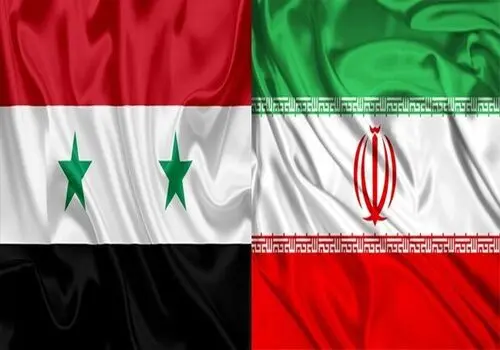 پرچم سیاه داعش روی بازوی شورشیان سوریه
