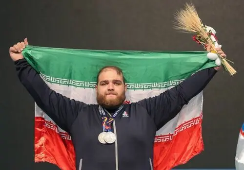چهره پدر قهرمان سنگین وزن وزنه برداری جهان پربازدید شد + فیلم