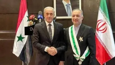 اهدای نشان شایستگی به سفیر ایران توسط بشار اسد