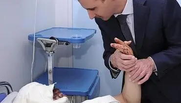 عکس: دیدار بشار الأسد با یکی از مجروحان جنگ داخلی سوریه