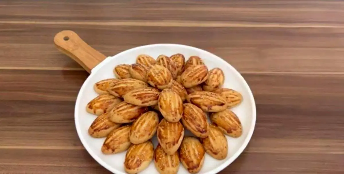 طرز تهیه خوشمزه‌ترین شیرینی کنجدی فقط در ۱۰ دقیقه+ فیلم / ساده ترین دستور پخت شیرینی کنجدی برای عصرانه