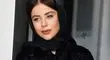 چهره متفاوت الهام اخوان با موی فرفری و عینک چندرنگ